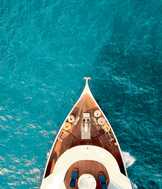Image showcasing a boat on a beautiful blue ocean